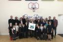 Matthew Dobson (centre) with children, staff and governors of Crosthwaite Church of England Primary School