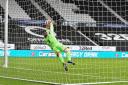 DERBY, ENGLAND. SEPTEMBER 5TH Joel Dixon of Barrow dives to save a penalty during the Carabao Cup match between Derby County and Barrow at the Pride Park, Derby (Credit: Jon Hobley | MI News).