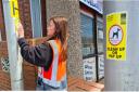 PATROL: A 'No Dog Fouling' sticker being placed on a lamp post