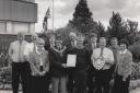 Glaxo Wellcome gardener Tommy Clark receives a certificate of commendation from Cumbria in Bloom and the factory's Good Housekeeping Shield for July and August in 1997