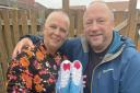 Mr and Mrs Dale with the boots donated by Stanway for their fundraising efforts