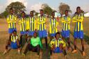 Superade Soccer Excellence in Ndola, Zambia wearing Walney Island Junior FC football kits