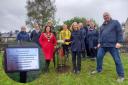 The planting ceremony at Lightburn Park last year, along with an example of the new plaques