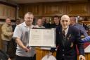 Millom's oldest surviving player and Vice Chairman Paul Roskell with the letters from King Charles and Rishi Sunak