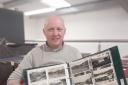 1818 Auctioneers Assistant Manager Simon Thompson with postcard collection