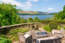 The cannon on a terrace at The Fort, which enjoys spectacular views across Derwentwater to the fells beyond