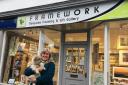 HAPPY: Fay Powley, a recipient of the grant scheme last year, standing outside her shop with dog Daisy