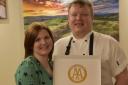 Chef Mark Satterthwaite and his wife with Rosette Award for Culinary Excellence.