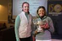 VICTORS: Katie Sibley (R) receiving the County Championship Trophy from last year’s holder, Nicola Wood.