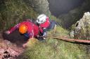 The mountain rescue team members had to descend Piers Gill via rope to access the stranded walker