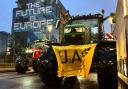 A protest by farmers outside a meeting of EU agriculture ministers in Brussels (Sylvain Plazy/AP)