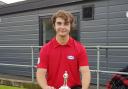 WELL DESERVED: Callum Sharples poses with the BCGBA Junior Individual Merit trophy