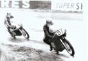 Oulton Park:-  A Youthful Les T no 97 on the BSA before "taking advice" Note on the back is V Cooper.  Vernon Cooper passed away in 1970  and was an amateur snapper so I can`t see any probs if you use it Apologies for the quality