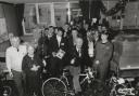Retired Glaxo engineer Roy Crawford, front centre, receiving some of the renovated toys and bikes for the annual WRVS Christmas Appeal in 1994 from first year apprentices (Picture: T and J Photographic)