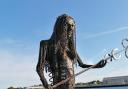The 12-foot tall mermaid is made up of recyclable materials