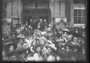 A crowd of people look back at the camera from the entrance of the new Salvation Army Hall in 1910