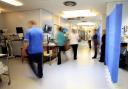 Staff on an NHS hospital ward (PA)