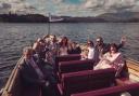 Newlyweds with their 10 guests on the wooden jetty