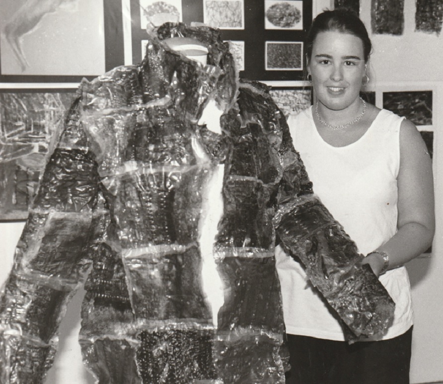 COLLEGE: Lucy Crowe, 18, with a coat made from treated plastic at an exhibition of work produced by art and design students from Barrow Sixth Form College at The Dock Museum in 1997