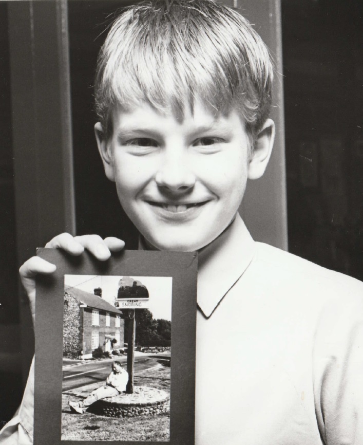 SMILE: Young photographer Ben Steel, 12, displays his prizewinning photograph at the annual spring show at John Ruskin School in 1991