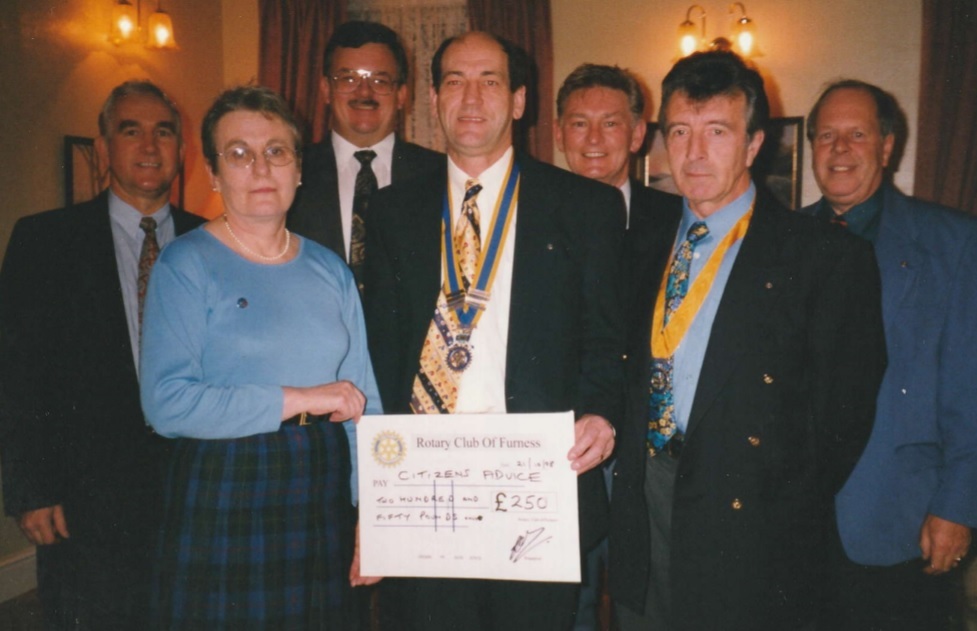 BARROW: President Dave Ward with some members of the Rotary Club of Furness presents a cheque for Â£250 for the Citizens Advice Bureau to Noreen Thompson in 1999