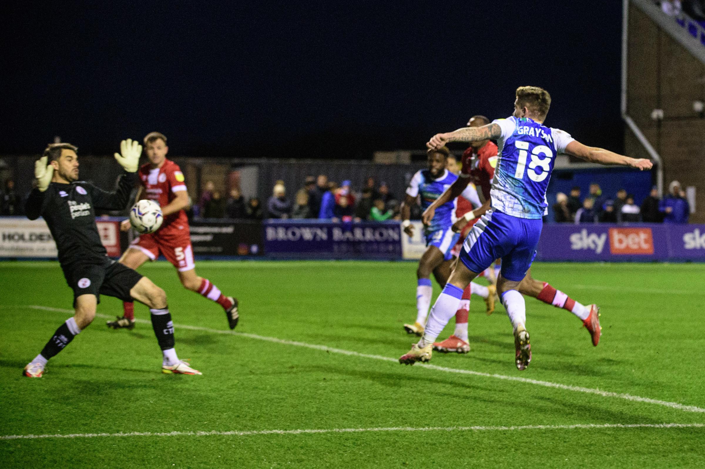 ATTEMPT: Joe Grayson of Barrow FC tries a shot on goal only for Glenn Morris of Crawley Town FC to save it at Holker Street. (Ian Charles | MI News)