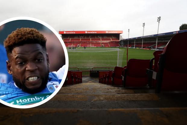 Zanzala, inset, suffered a knee injury playing for Exeter City at Walsall's Banks's Stadium (photos: PA)