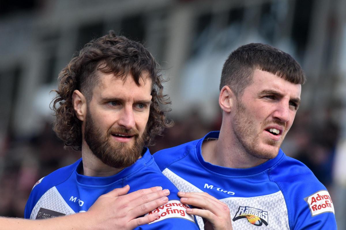 Brett Carter, left, with Shane Toal after his try. Pictures: Chris Warner