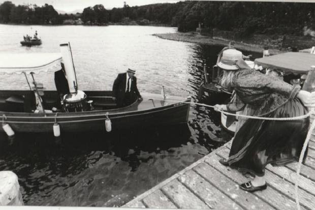 Catherine Allard, general manager of the Windermere Steamboat Museum, helps moor the steam launch Suilven during the annual rally of the Steamboat Association of Great Britain, at Windermere, in 1995