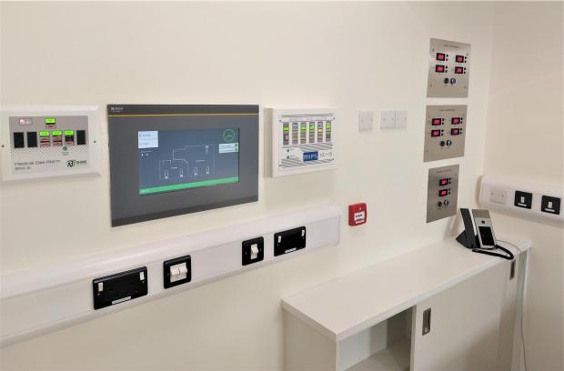 The Mail: A touchscreen CP915 nurse station alarm panel (left)