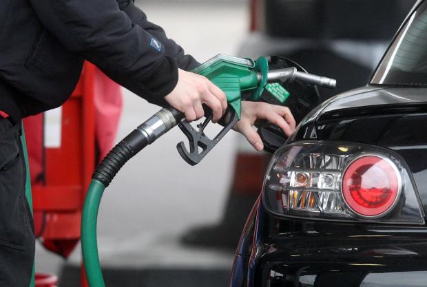 The Mail: Someone using a fuel pump at a petrol station (PA)