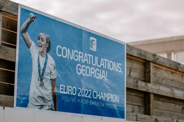 The poster is on the side of the stadium, and has even had a response from Georgia and an Argentinian football website