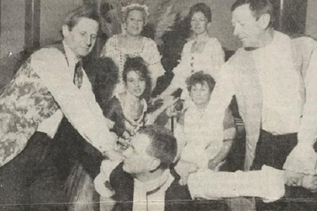 Richard Foster (kneeling) as Tartuffe with other members of the cast of Ulverston Outsiders' production of Tartuffe in 1993