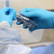 A test tube is cleaned on arrival at the new Covid-19 testing lab at Queen Elizabeth University Hospital, Glasgow..