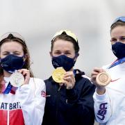 Bermuda’s Flora Duffy (centre) with her gold medal after winning the Women’s Triathlon alongside Great Britain’s Georgia Taylor-Brown (left) who placed second and USA’s Katie Zaferes who placed third at the Odaiba Marine Park on