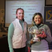 VICTORS: Katie Sibley (R) receiving the County Championship Trophy from last year’s holder, Nicola Wood.