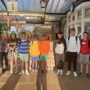 The group waiting for the train to go down to London after an early start.
