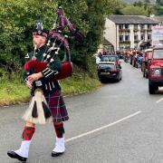 Scottish bagpiper leads the Furness & District Tractor Run