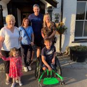Tony Hudgell and family outside of The Swan in Grasmere