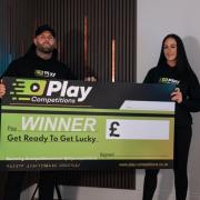 Kade Kendall and Siobhan Rooke with a blank Play cheque