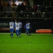 Ben Whitfield is congratulated by team-mates after opening the scoring against Accrington Stanley