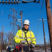An Electricity North West overhead linesperson