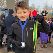 Tom with his medals at the National Primary and Year Seven Cross Country Finals