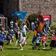 Activities on offer include jousting, archery, axe throwing, and sword skill sessions