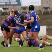 Jodie Morley is halted by four Featherstone Rovers players