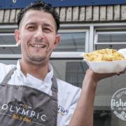Khaled Barkahoum from Olympic Chippy on National Fish and Chip week with a huge helping of chips. Thursday May 31st 2018. PICTURES by MILTON HAWORTH.