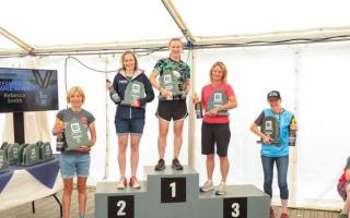 Lakeside Triathlon winner Rebecca Smith pictured in first place on the podium