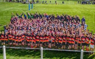 Players, staff and volunteers at the rugby club