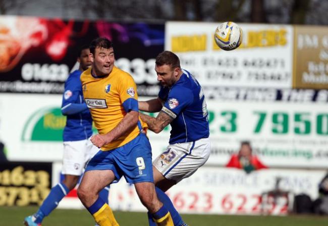 Football League career: Ian Evatt (right) in action for Chesterfield against Mansfield Town in 2014 Dan Westwell