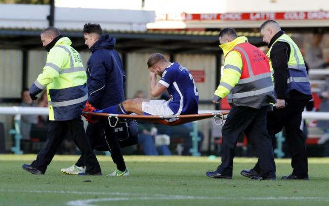 SEASON OVER Niall Cowperthwaite is stretchered off at Woking with a knee injury
